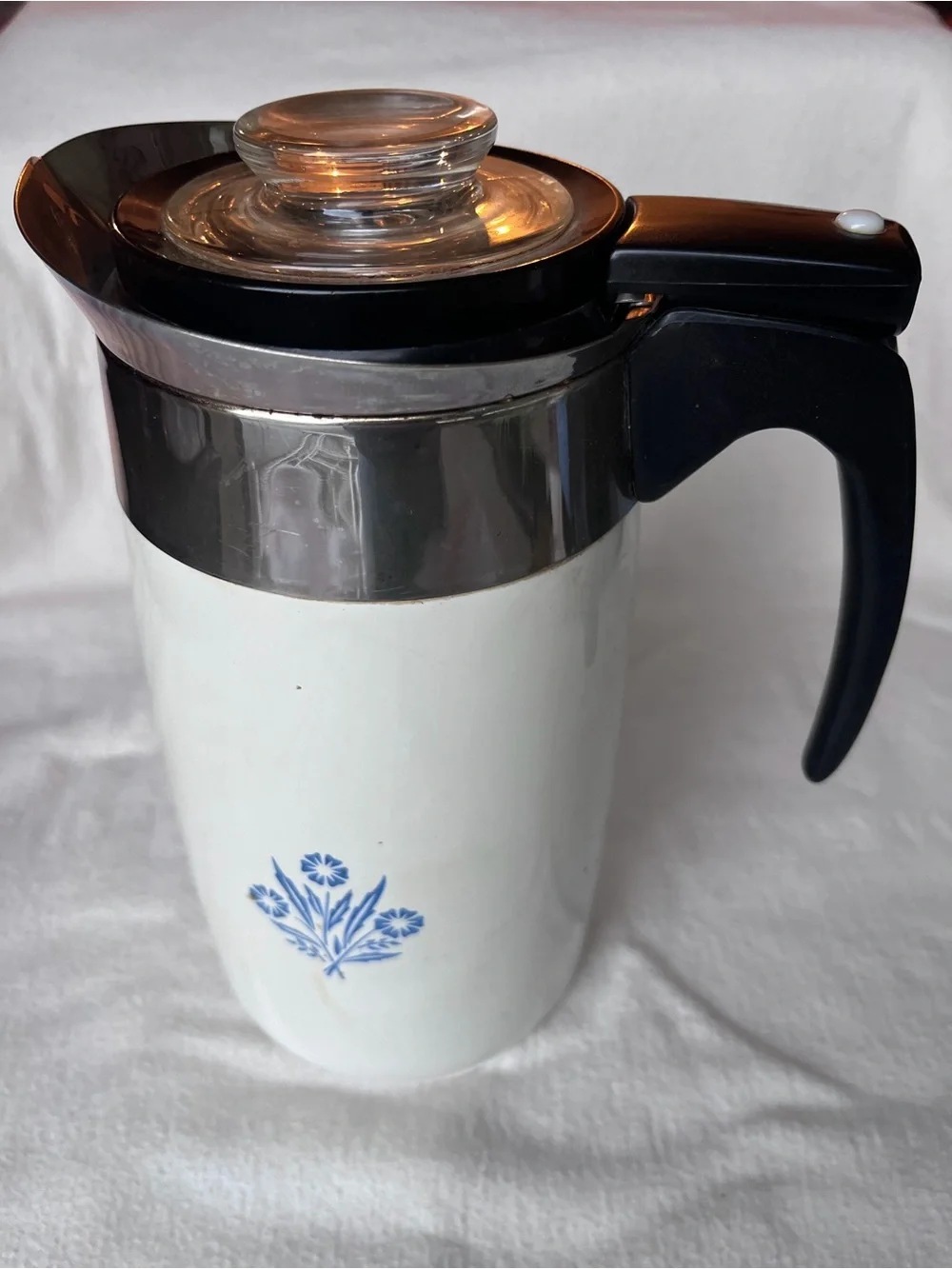 Classic Ceramic Pitcher with Black Handle and Blue Floral Accent